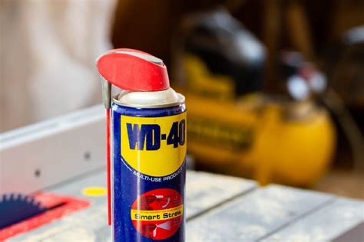 Does WD-40 remove adhesive from car paint?