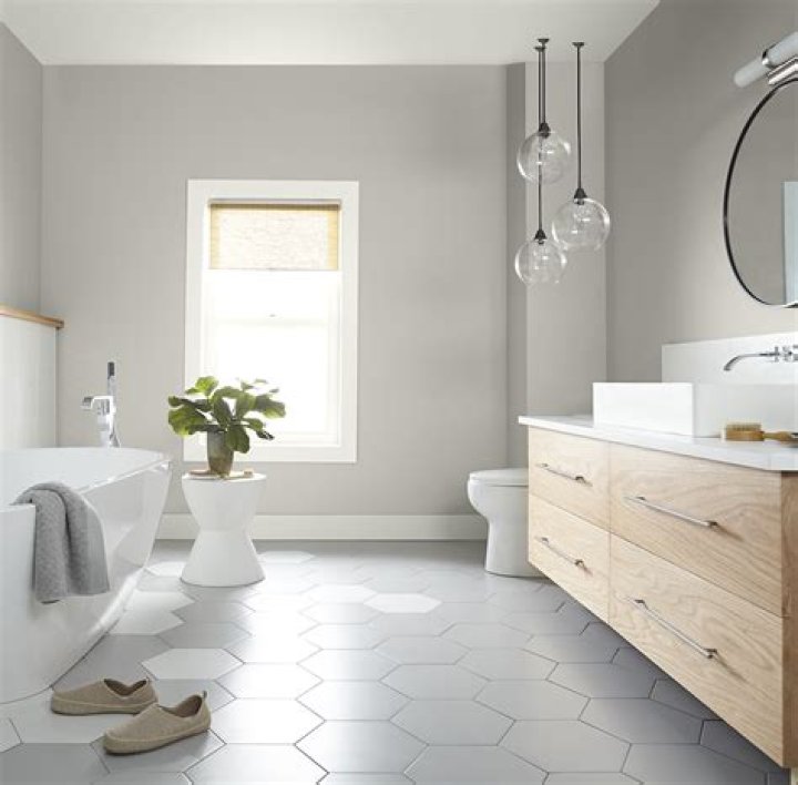 Should small bathrooms be painted light or dark?