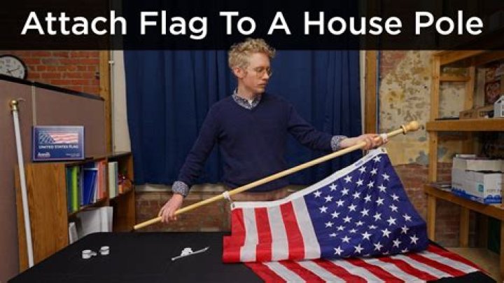 Where should a flag pole be placed on a house?