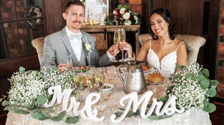Who normally sits with the bride and groom?